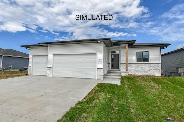 view of front facade featuring a garage and a front lawn