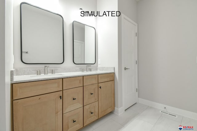 bathroom with visible vents, a sink, baseboards, and double vanity