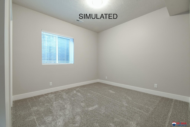 carpeted empty room with visible vents, a textured ceiling, and baseboards