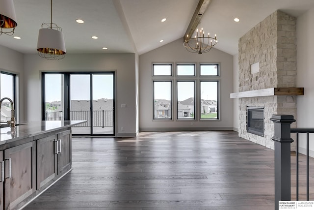 unfurnished living room with a stone fireplace, plenty of natural light, and dark wood-type flooring