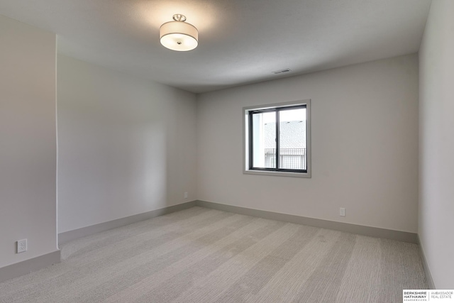 view of carpeted spare room