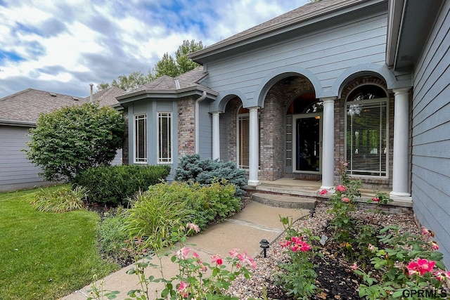 doorway to property featuring a yard