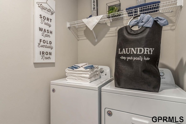 laundry room with washer and dryer and laundry area