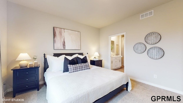 bedroom featuring carpet flooring and ensuite bathroom