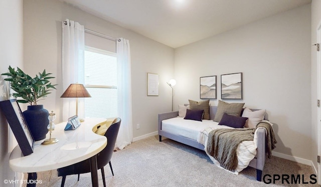 carpeted bedroom with lofted ceiling