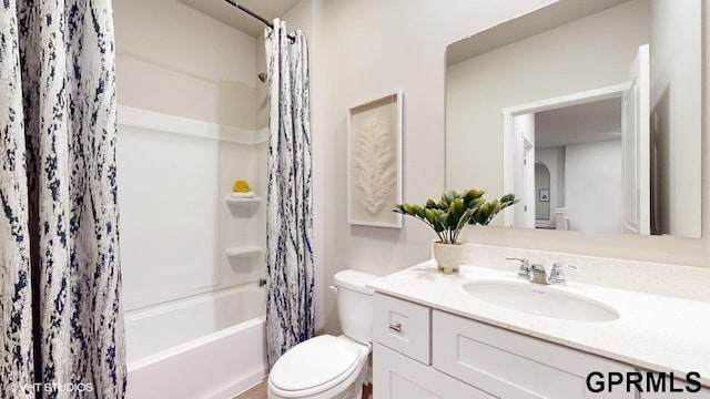 full bathroom with vanity, toilet, and shower / bathtub combination with curtain