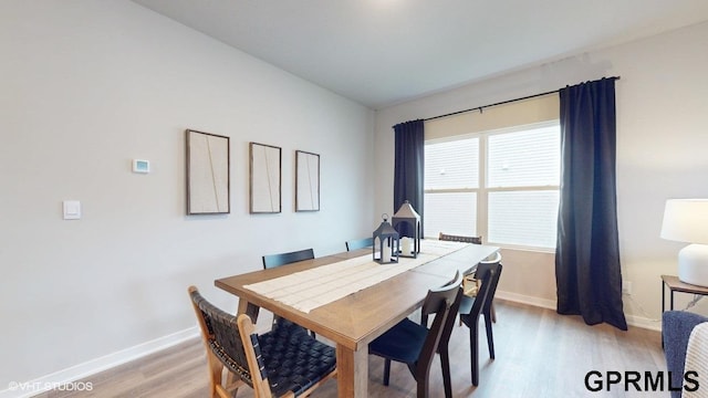 dining space featuring light hardwood / wood-style floors