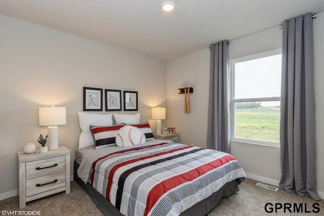 bedroom with light colored carpet