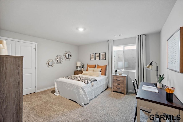 bedroom featuring light carpet