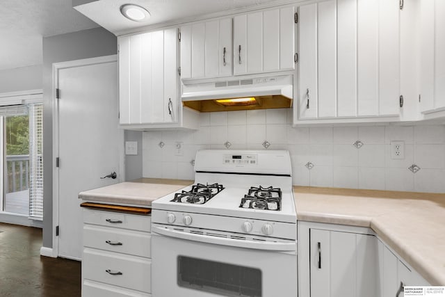 kitchen featuring a textured ceiling, backsplash, gas range gas stove, dark hardwood / wood-style floors, and white cabinets