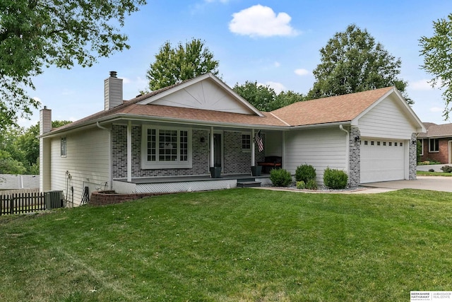 ranch-style home featuring a garage, a porch, and a front lawn