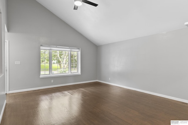 empty room with dark wood-type flooring, ceiling fan, and high vaulted ceiling