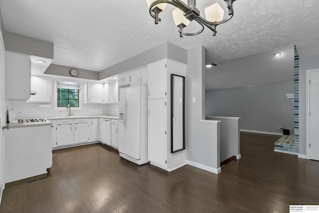 kitchen with a textured ceiling, white cabinetry, dark hardwood / wood-style flooring, and white fridge with ice dispenser