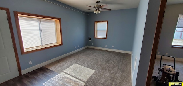 carpeted empty room featuring ceiling fan