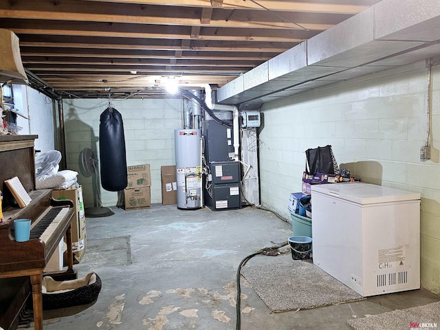 unfinished basement with gas water heater, refrigerator, and heating unit