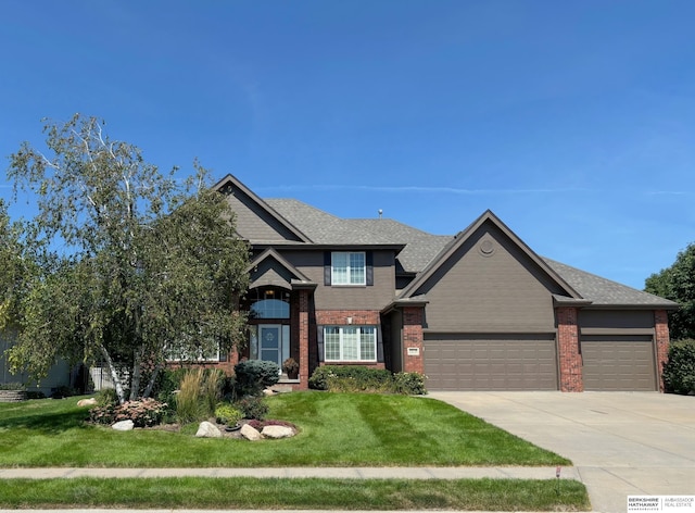 view of front facade featuring a garage and a front lawn