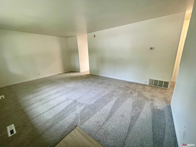 empty room featuring carpet flooring