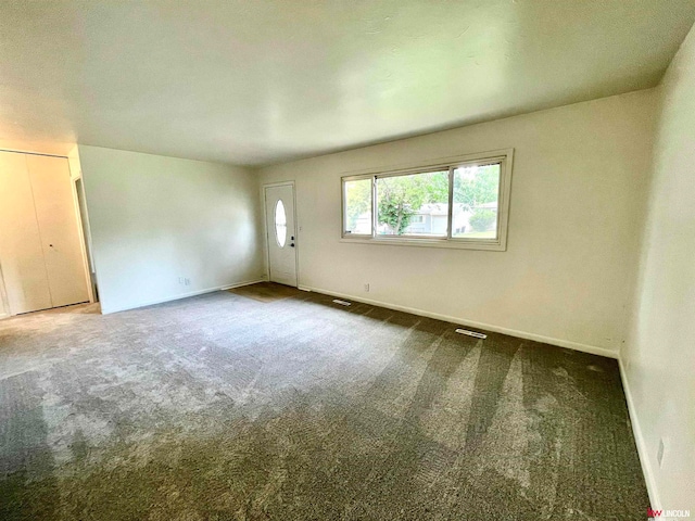 spare room with carpet floors