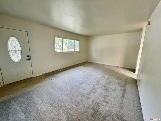 foyer entrance featuring hardwood / wood-style flooring