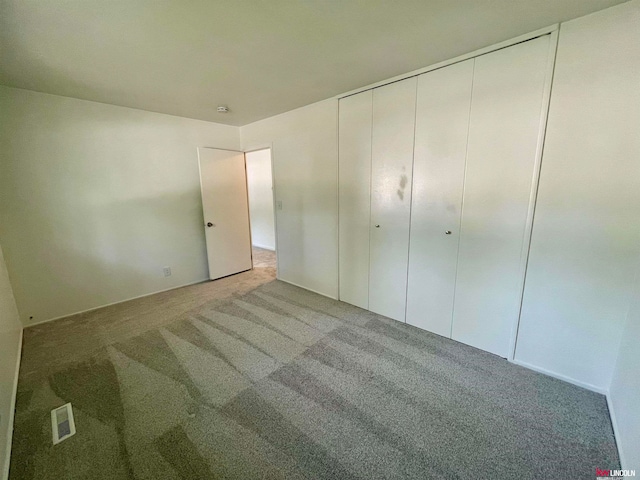 unfurnished bedroom featuring carpet