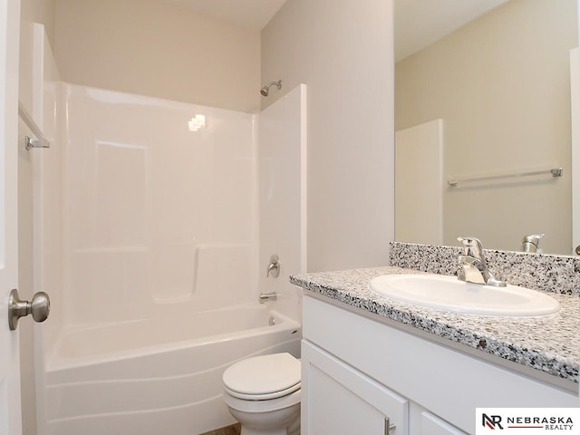 bathroom featuring tub / shower combination, toilet, and vanity