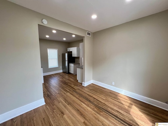 unfurnished living room featuring hardwood / wood-style floors