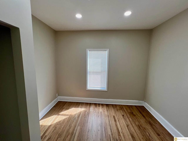 unfurnished room featuring hardwood / wood-style floors