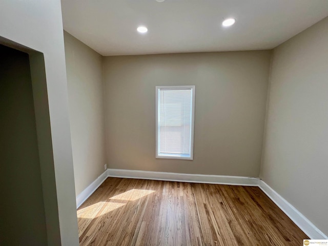 unfurnished room featuring light hardwood / wood-style floors