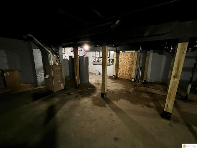 basement featuring heating unit and gas water heater