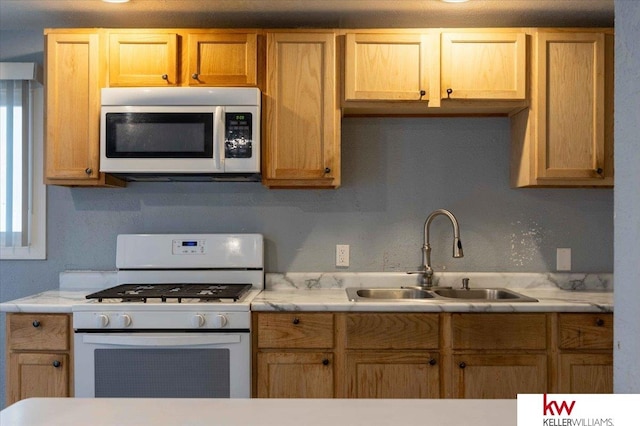 kitchen featuring sink and white gas range oven