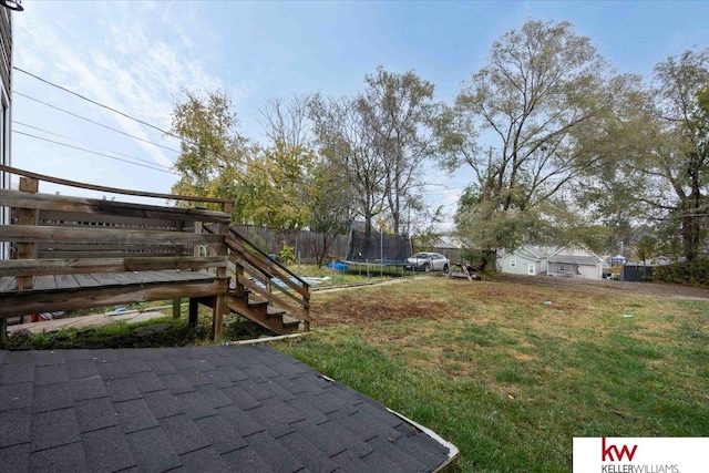 view of yard with a trampoline