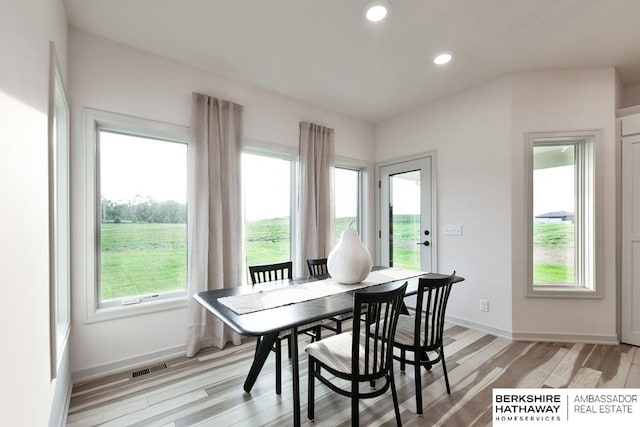 dining room with light hardwood / wood-style flooring