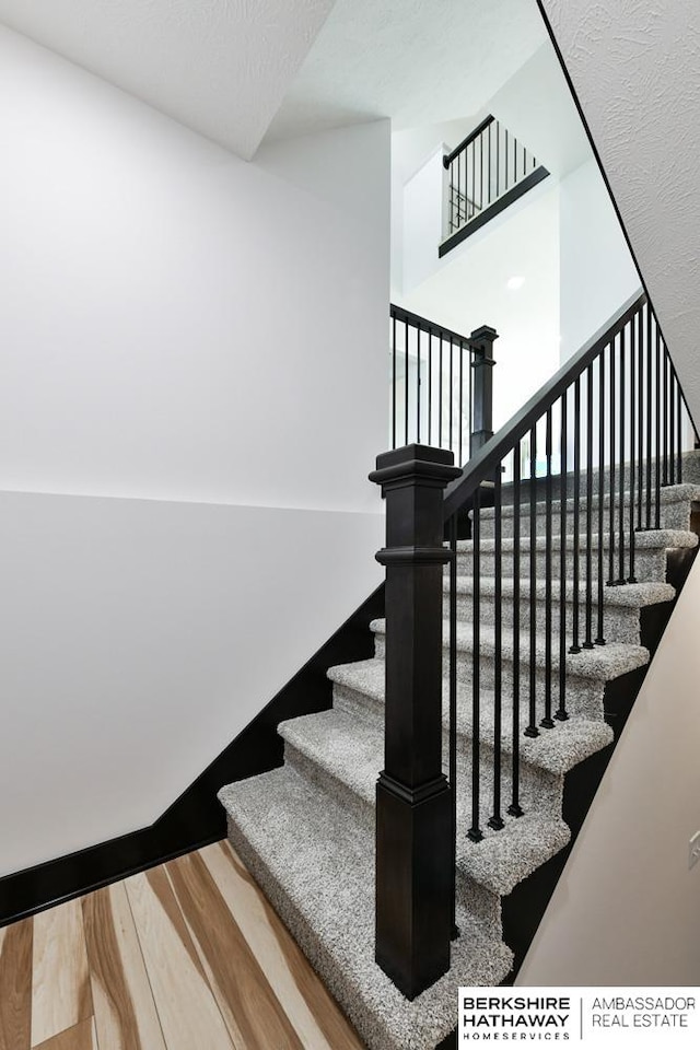 stairway with wood-type flooring