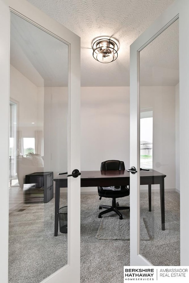 office area featuring a textured ceiling and french doors