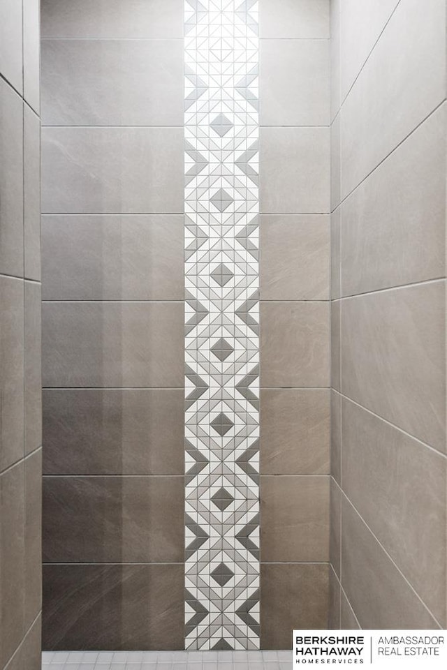 bathroom with a tile shower