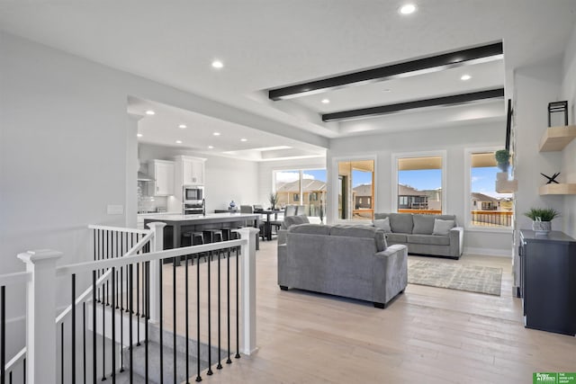 living room with light hardwood / wood-style flooring