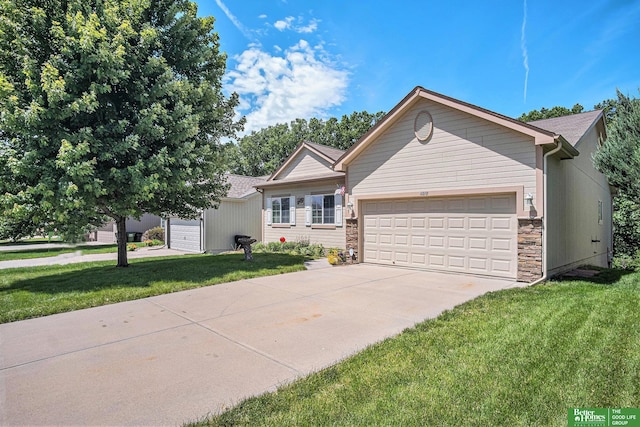 view of front of home featuring a garage and a front yard