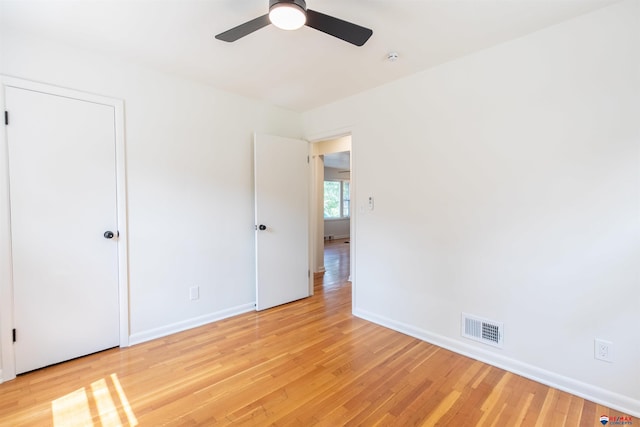 spare room with ceiling fan and light hardwood / wood-style floors