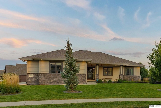 prairie-style house with a yard