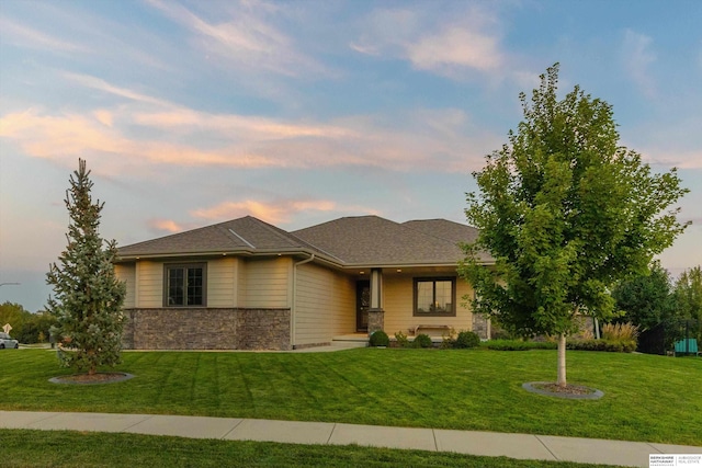 prairie-style home featuring a yard