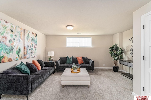 living room with a textured ceiling and carpet floors