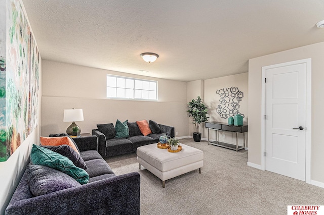 carpeted living room featuring a textured ceiling