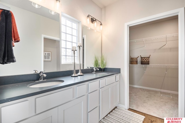 bathroom with vanity and hardwood / wood-style flooring