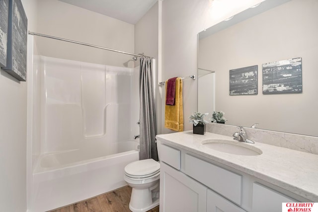 full bathroom featuring vanity, toilet, wood-type flooring, and shower / tub combo with curtain