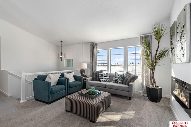 carpeted living room with a textured ceiling