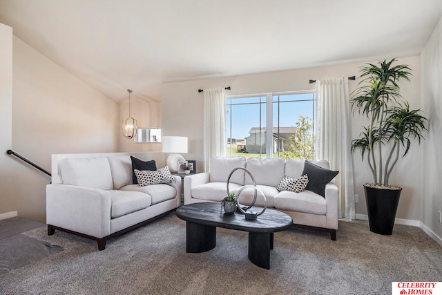 living room featuring lofted ceiling and carpet