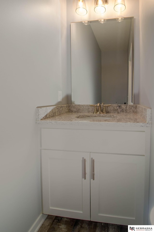 bathroom with wood-type flooring and vanity