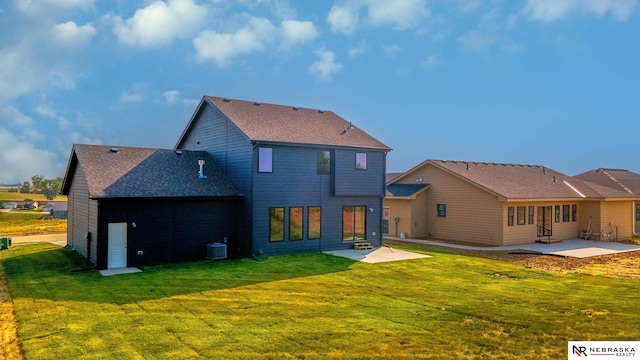 rear view of house featuring cooling unit, a yard, and a patio area