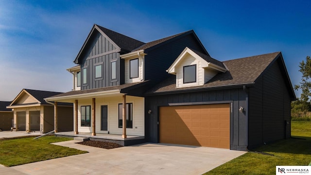 view of front of property with a front lawn and a garage