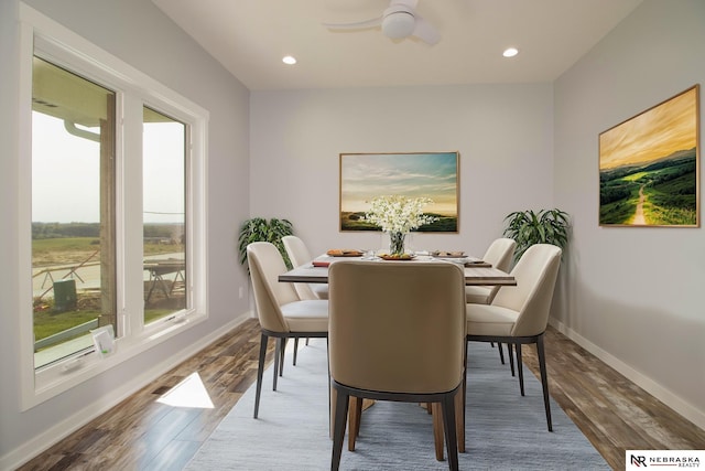 dining room with wood-type flooring and ceiling fan